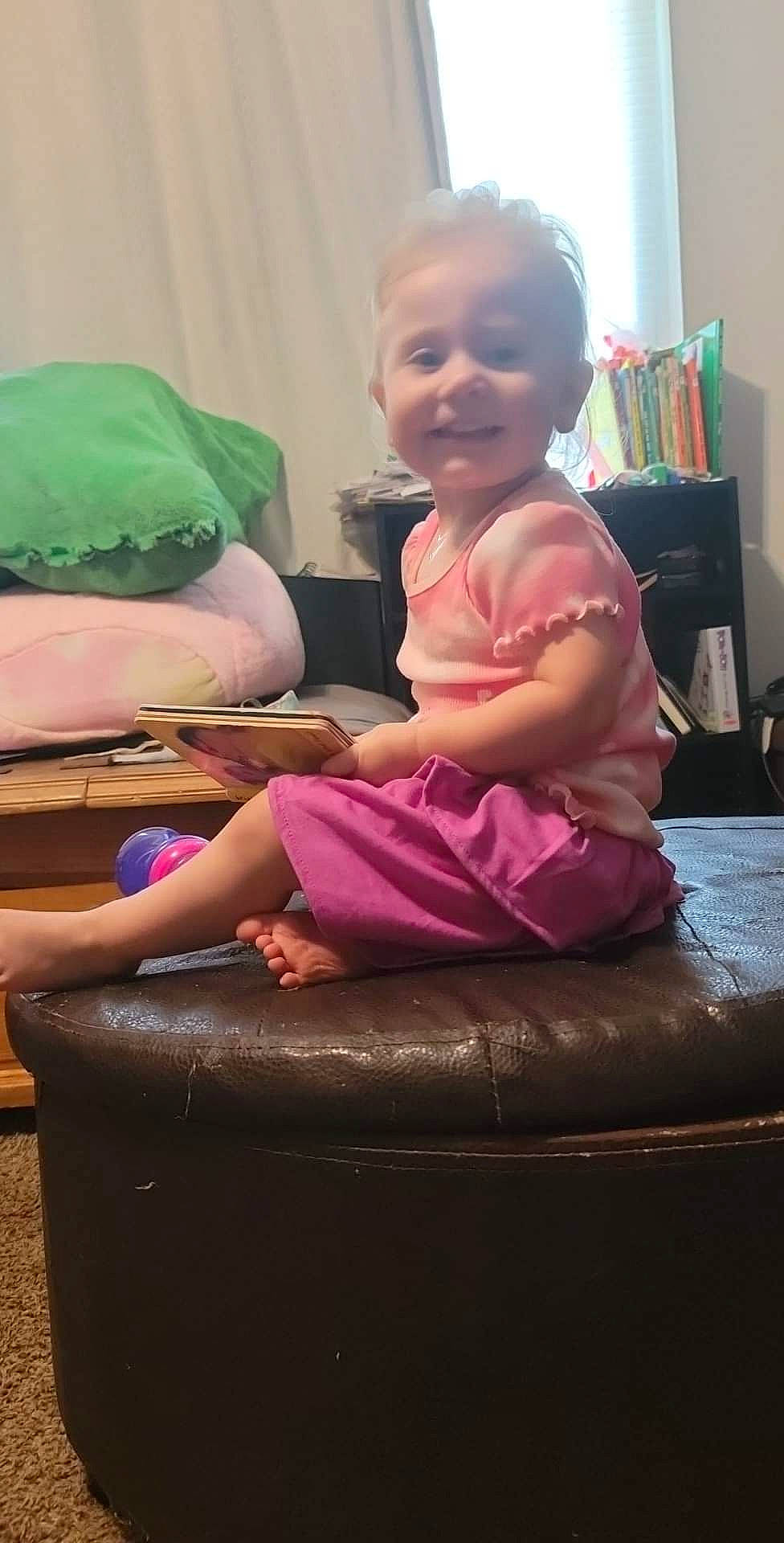 Shamaya is registered to the contest to win money with this photo: baby, baby_toddler_clothing, beauty, black, child, comfort, event, flooring, fun, happy, joy, lap, leisure, magenta, mammal, person, pink, purple, sitting, skin