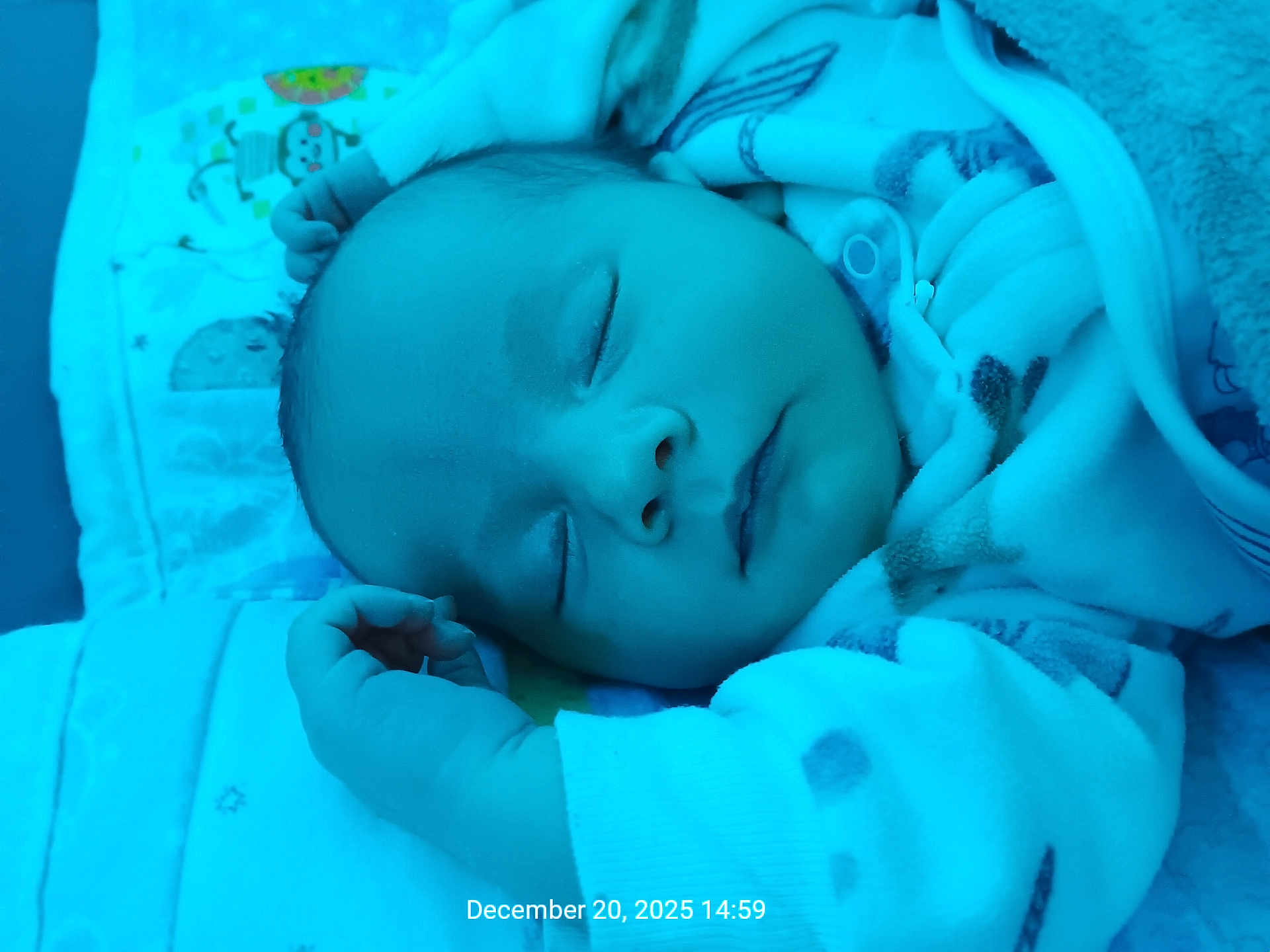 Maelle is registered to the contest to win money with this photo: baby, sleeping, infant, blanket, clothing, cozy, face, hand, peaceful, portrait, child, indoors, cute, soft_light, rest, newborn, closeup, babywear, sleep, toddler