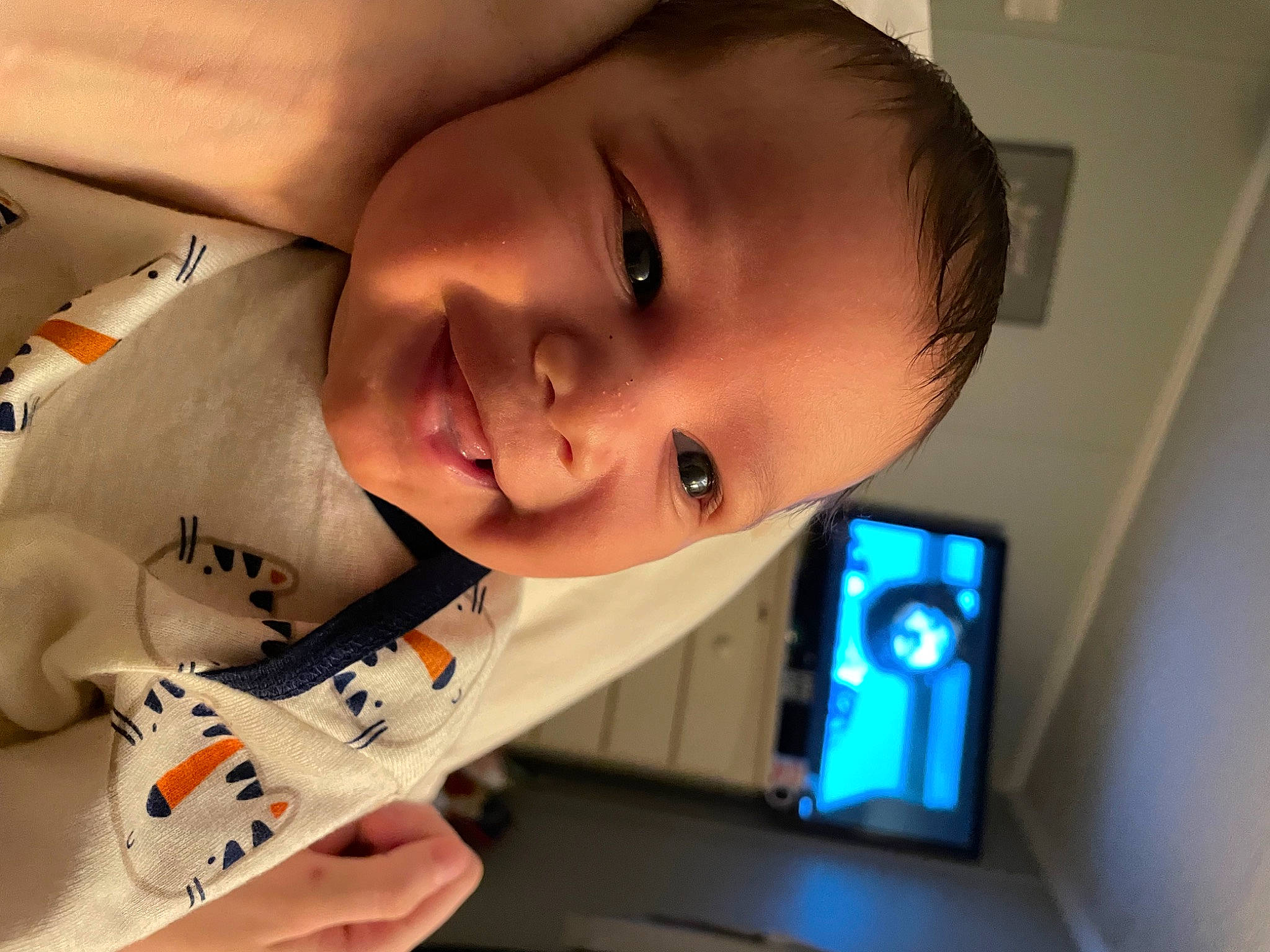 Cyrus is registered to the contest to win money with this photo: arm, baby, black_hair, cheek, ear, eyebrow, eyelash, face, finger, forehead, fun, happy, human_body, joy, lip, mouth, neck, nose, person, skin