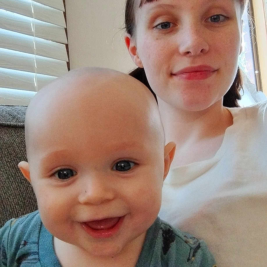 Axl joined the competition — help win amazing prizes! baby, bodypart, clothing, couch, face, furniture, happy, head, homedecor, indoors, laughing, mouth, person, photography, portrait, selfie, smile, t_shirt, teeth, window