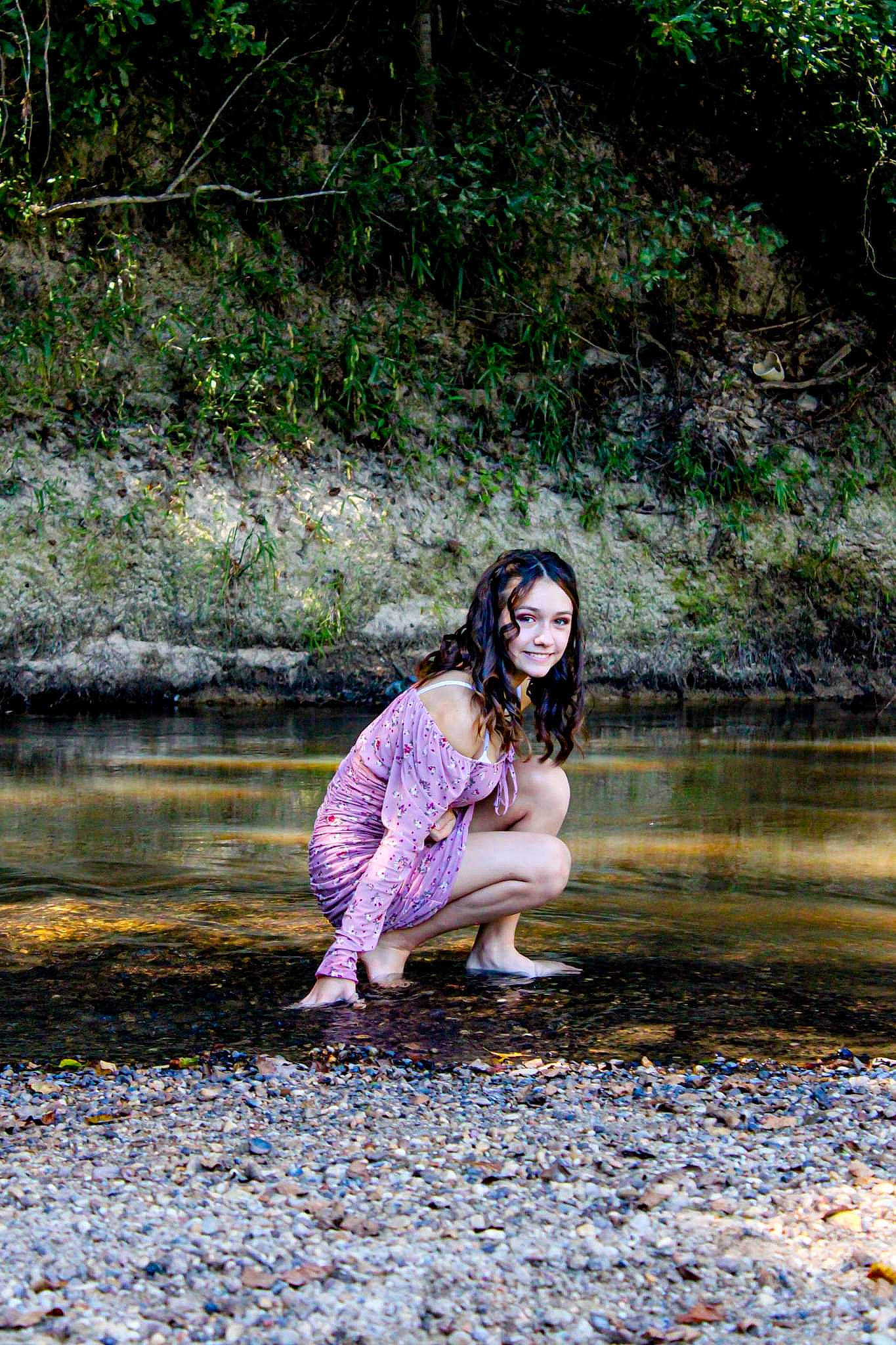 Sidney is registered to the contest to win money with this photo: branch, fawn, flash_photography, forest, grass, happy, human_leg, joy, lake, landscape, leisure, natural_landscape, people_in_nature, person, plant, rock, smile, stream, tree, water