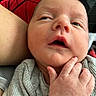 Asher joined the competition — help win amazing prizes! newborn, baby, infant, child, face, portrait, close_up, awake, curious, open_mouth, gray_clothing, sweater, hand, adult_hand, parent, indoor, cuddling, human, soft_lighting, photography