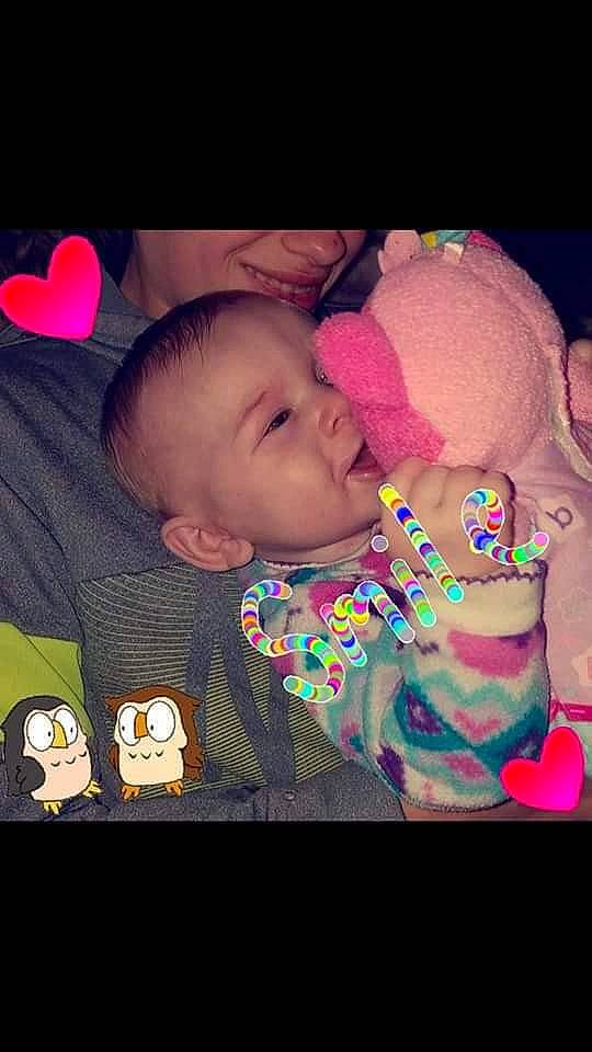 Angelique is registered to the contest to win money with this photo: cheek, child, emotion, eye, face, facial_expression, forehead, fun, head, human, infant, mouth, nose, organ, person, pink, purple, skin, smile, toddler