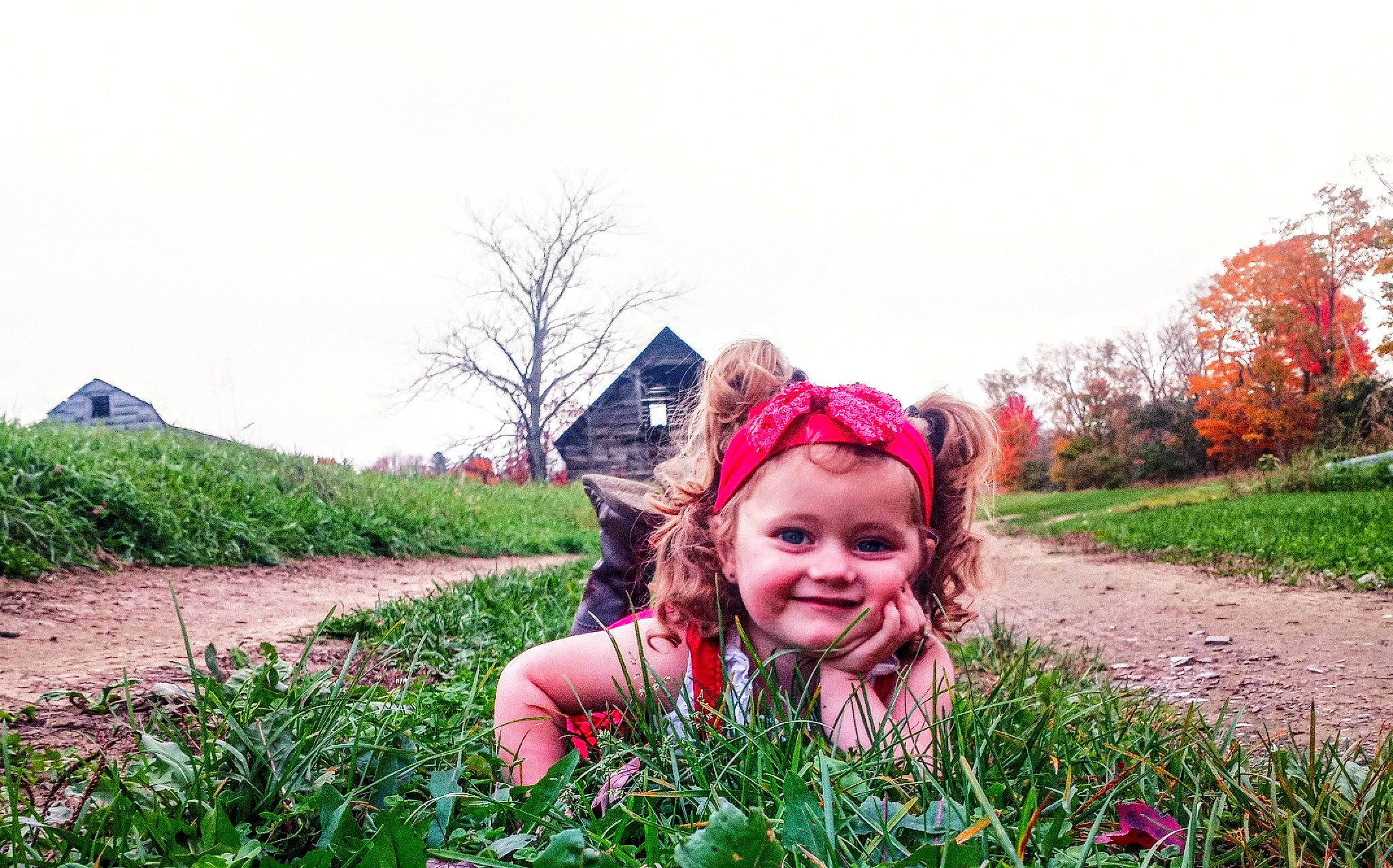 Emiliana is registered to the contest to win money with this photo: flower, fun, grass, grassland, happy, joy, landscape, leisure, magenta, meadow, natural_landscape, people_in_nature, person, plant, plantation, prairie, shrub, sky, smile, toddler