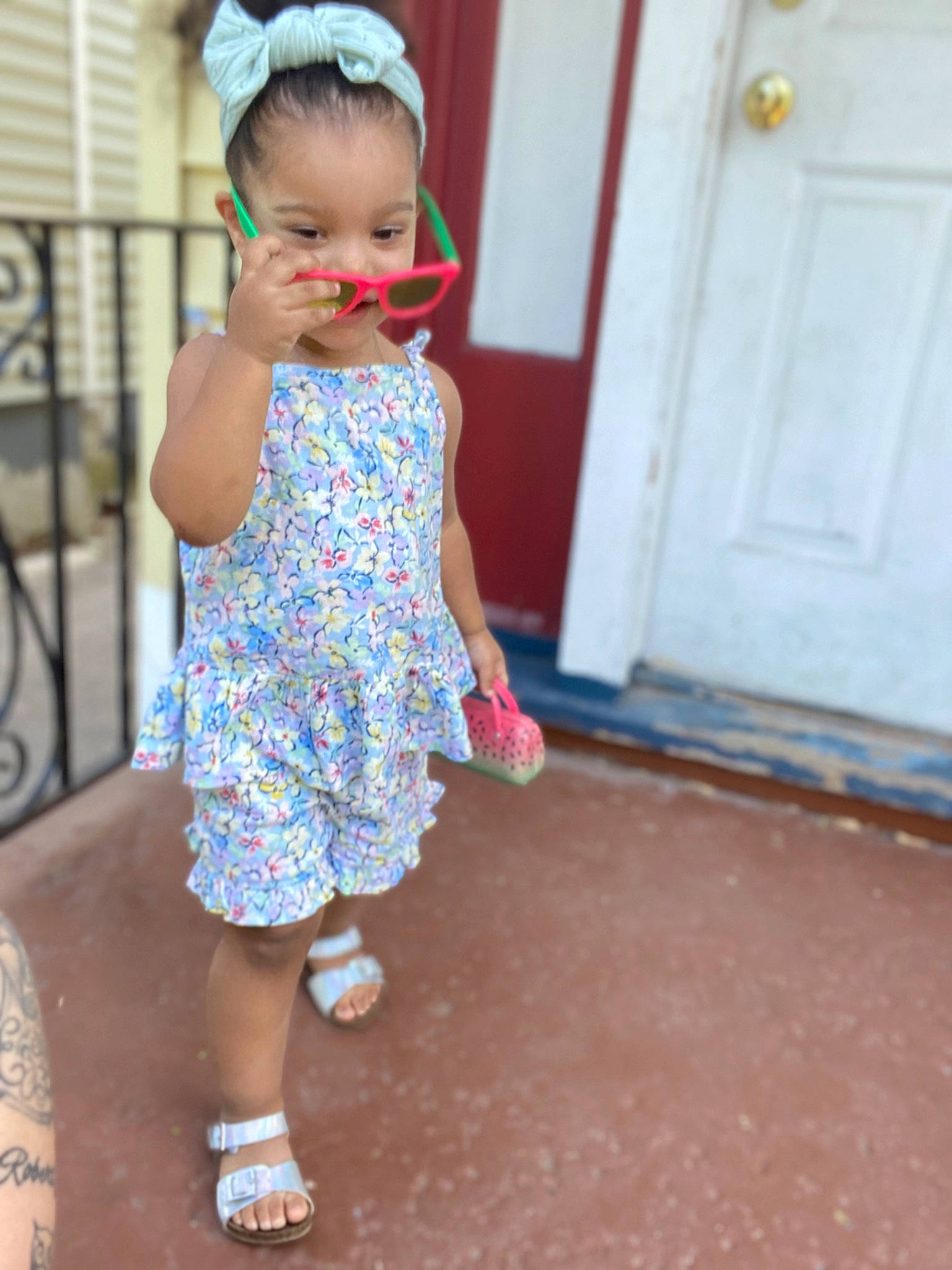 Kaylani Jimenez Perez joined the competition — help win amazing prizes! baby, baby_toddler_clothing, child, day_dress, door, door_handle, electric_blue, flooring, fun, happy, hat, home_door, human_leg, magenta, pattern, person, play, sandal, skin, sleeve