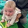 Cassandra joined the competition — help win amazing prizes! baby, child, crawling, blue_eyes, carpet, green, leaf_pattern, adult_hand, hoodie, indoor, person, clothing, curious, supporting_hand, floor, socks, cute, young_child, bright, soft_lighting