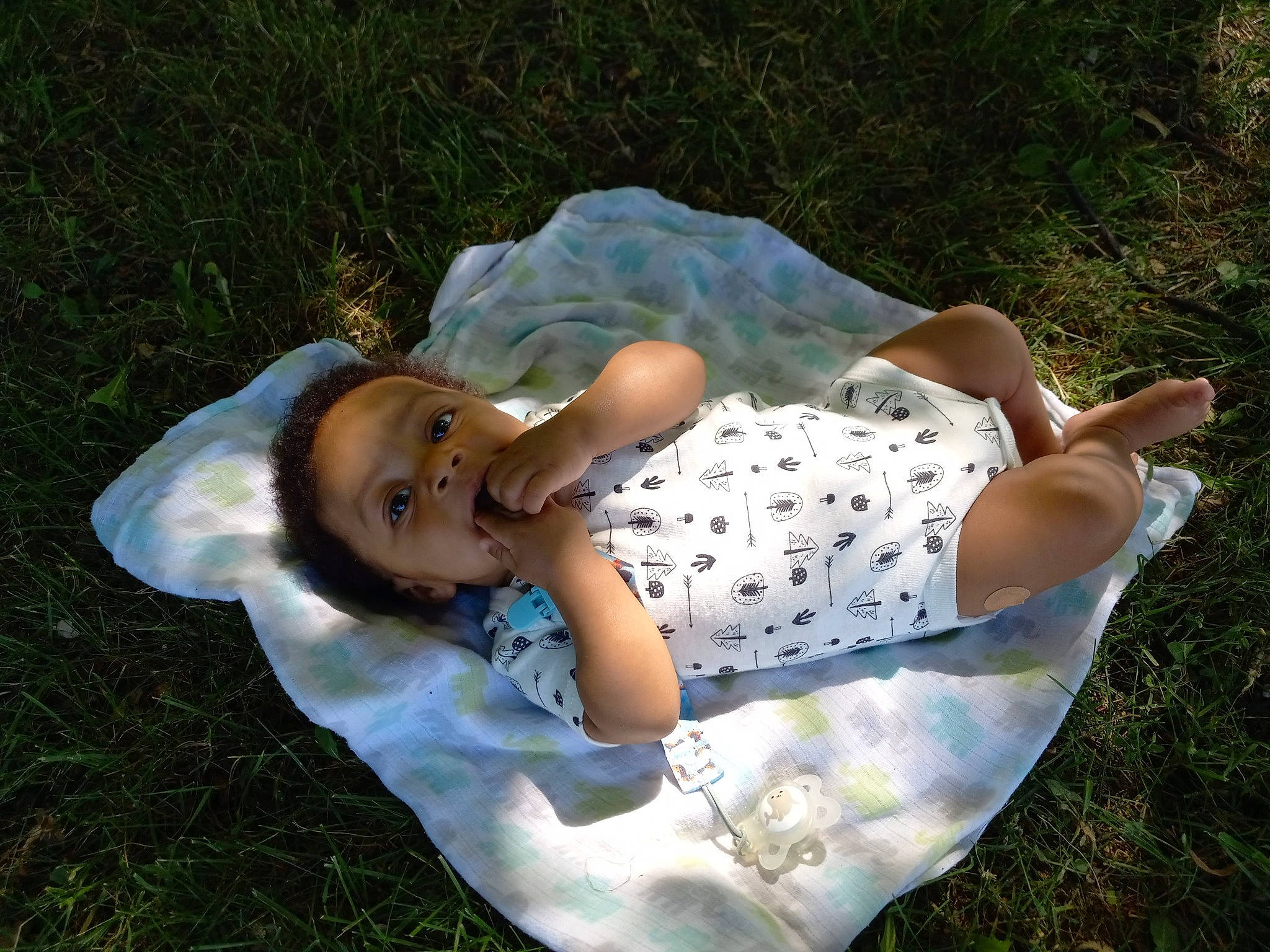 Cornelius is registered to the contest to win money with this photo: baby, baby_toddler_clothing, child, elbow, flash_photography, fun, gesture, grass, grass_family, grassland, happy, human_leg, lawn, leisure, meadow, people_in_nature, person, smile, thigh, toddler