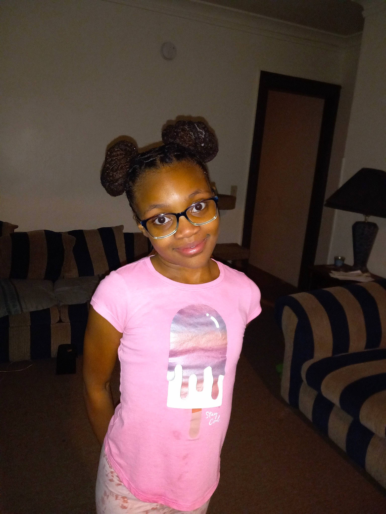 Zaidah is registered to the contest to win money with this photo: chest, couch, door, eyewear, fashion_design, flooring, forehead, fun, gesture, hairstyle, happy, joy, neck, person, room, shoulder, sleeve, smile, sportswear, t_shirt