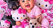Kalina is registered to the contest to win money with this photo: baby, dog, french_bulldog, small_dog, hello_kitty, plush_toy, pink_clothing, headband, heart_shape, blanket, toy, cute, smiling, indoor, child, accessory, pet, sitting, happy, decor