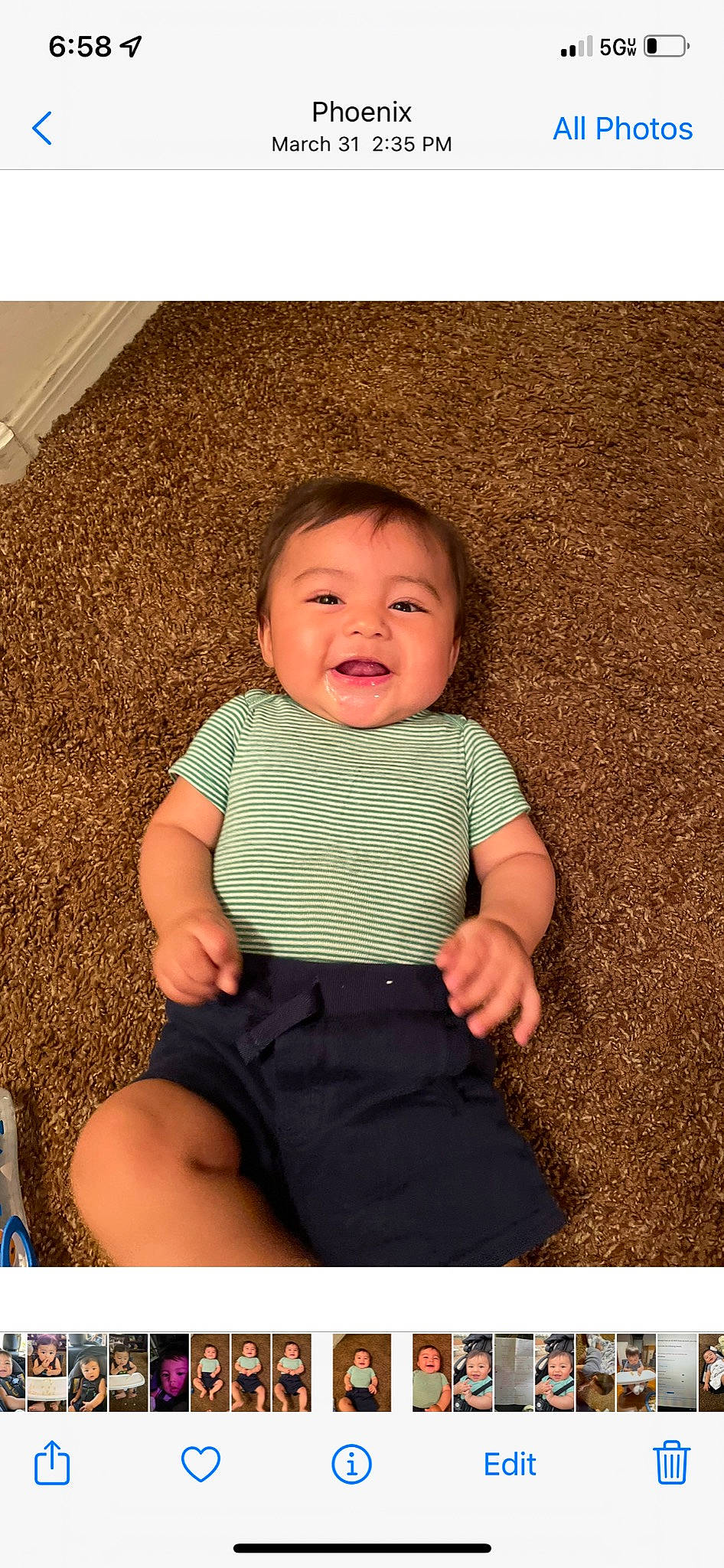 Israel is registered to the contest to win money with this photo: baby, baby_toddler_clothing, cheek, chin, flash_photography, fun, grass, hair, happy, human_body, iris, neck, nose, pattern, person, shorts, skin, sleeve, smile, t_shirt