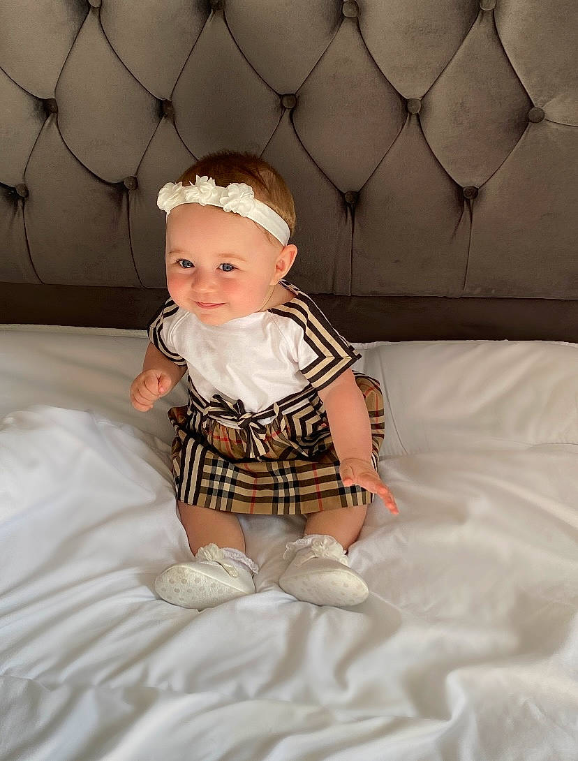 Londyn joined the competition — help win amazing prizes! baby, baby_toddler_clothing, child, clothing, comfort, dress, eye, flash_photography, fun, happy, hat, headwear, human_leg, joy, linens, pattern, person, pink, skin, sleeve