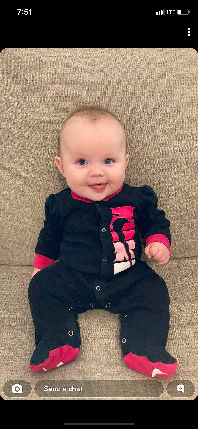 Emily joined the competition — help win amazing prizes! baby, baby_toddler_clothing, cheek, child, eye, face, flooring, fun, happy, head, human_body, joy, magenta, outerwear, pattern, person, skin, sleeve, smile, t_shirt