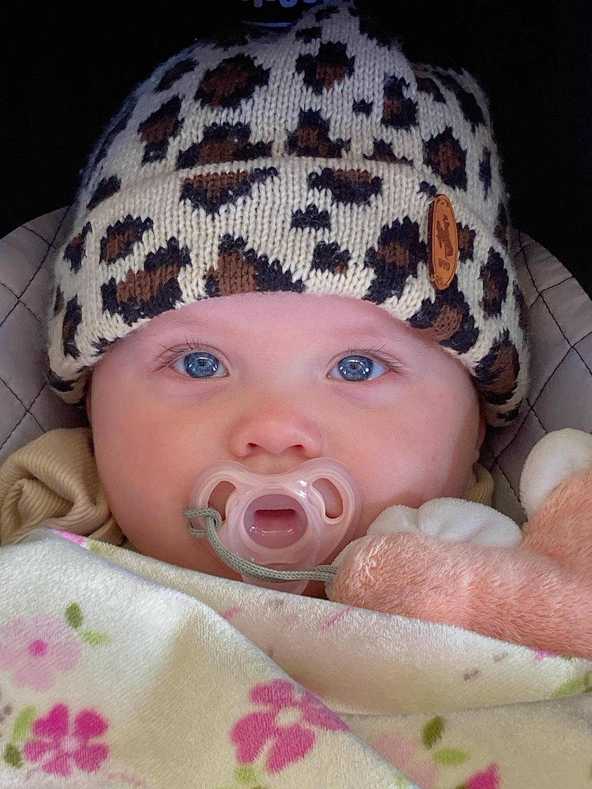 Emily is registered to the contest to win money with this photo: baby, baby_products, baby_sleeping, baby_toddler_clothing, cap, cheek, child, comfort, face, fashion_accessory, head, headgear, headwear, knit_cap, linens, lip, pattern, person, pink, skin