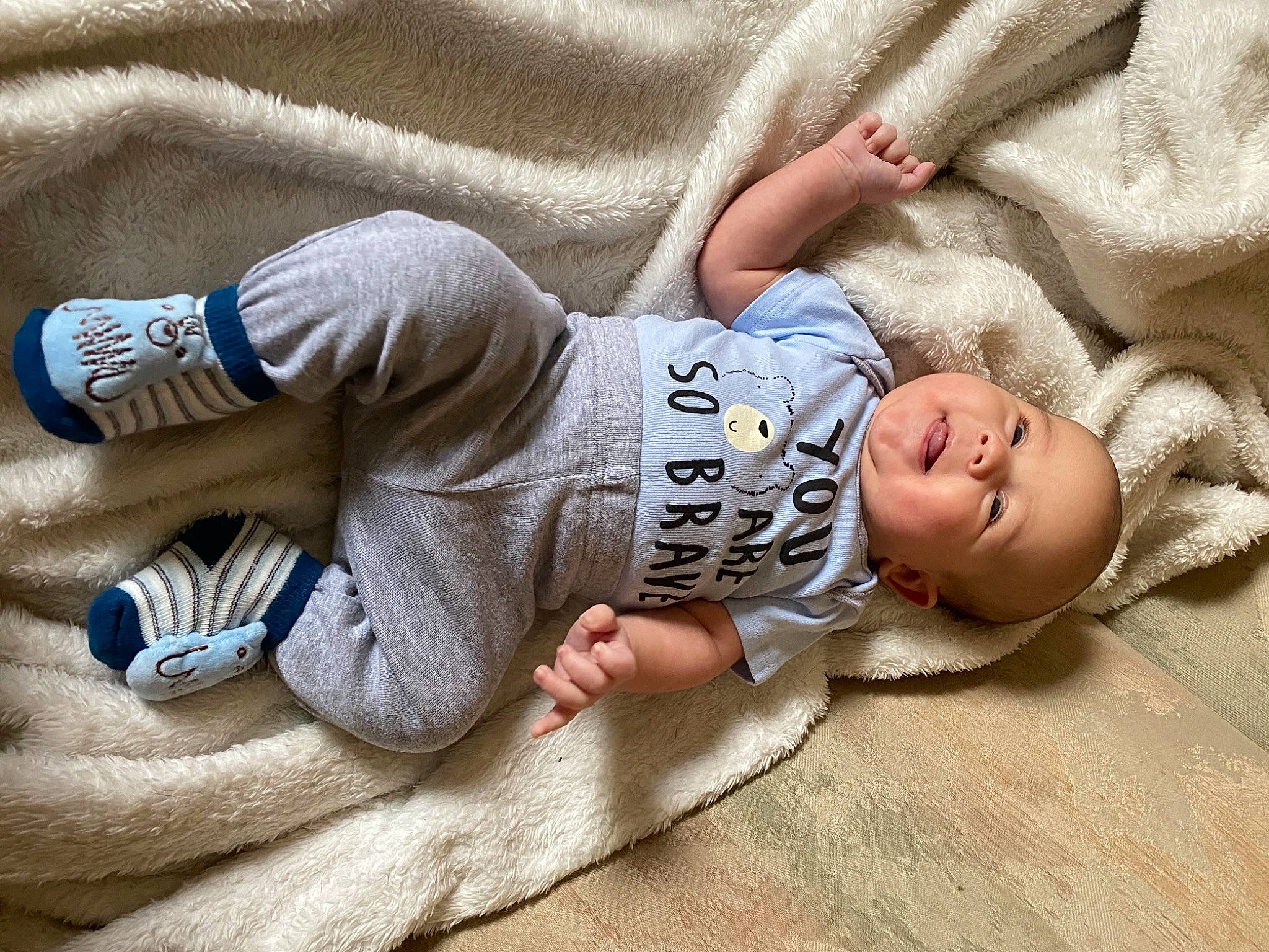 Keagan is registered to the contest to win money with this photo: baby, baby_products, baby_toddler_clothing, child, comfort, finger, human, mouth, person, skin, sleeve, sock, toddler, walking_shoe