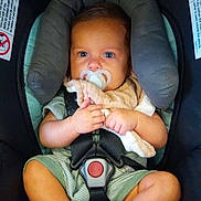 Bowie joined the competition — help win amazing prizes! baby, baby_clothes, blanket, blue_eyes, car_seat, child, clothing, comfort, cute, face, hands, head_support, indoor, infant, pacifier, portrait, safety, seatbelt, socks, toddler