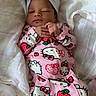 baby, infant, child, sleeping, face, portrait, indoors, bed, blanket, pajamas, pink_clothing, headband, bow, hello_kitty, strawberry, plaid, lying_down, cozy, cute, home