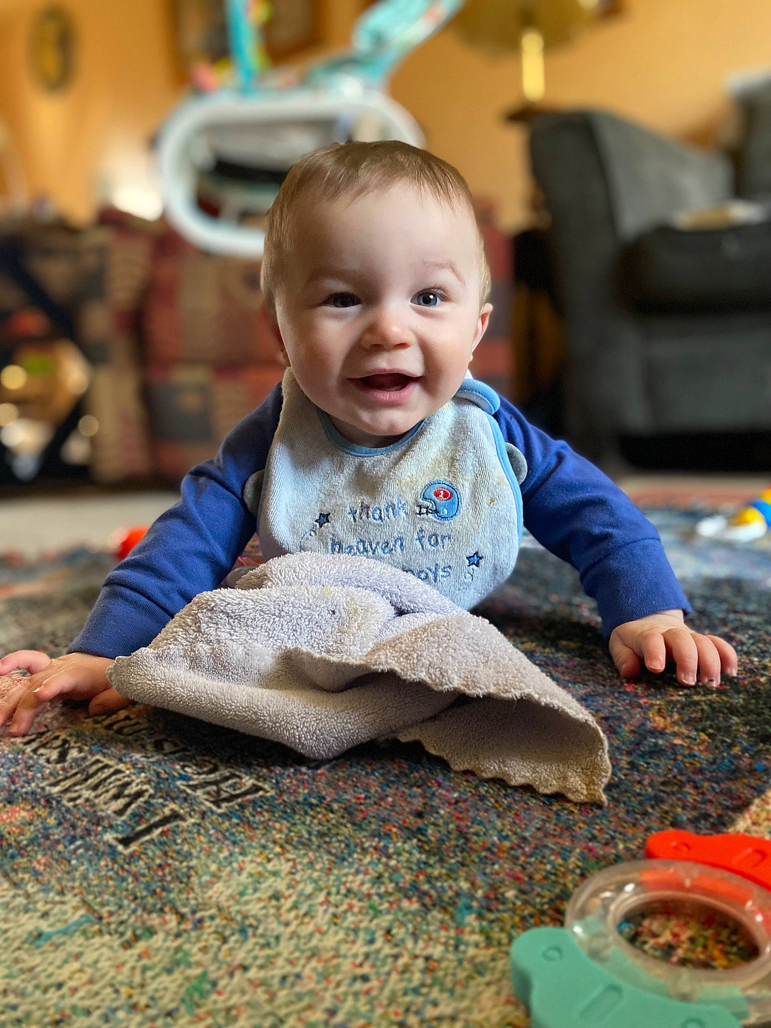 Lincoln is registered to the contest to win money with this photo: baby, baby_products, baby_toddler_clothing, child, comfort, couch, floor, flooring, fun, grass, happy, leisure, person, play, room, sitting, skin, smile, toddler, tummy_time