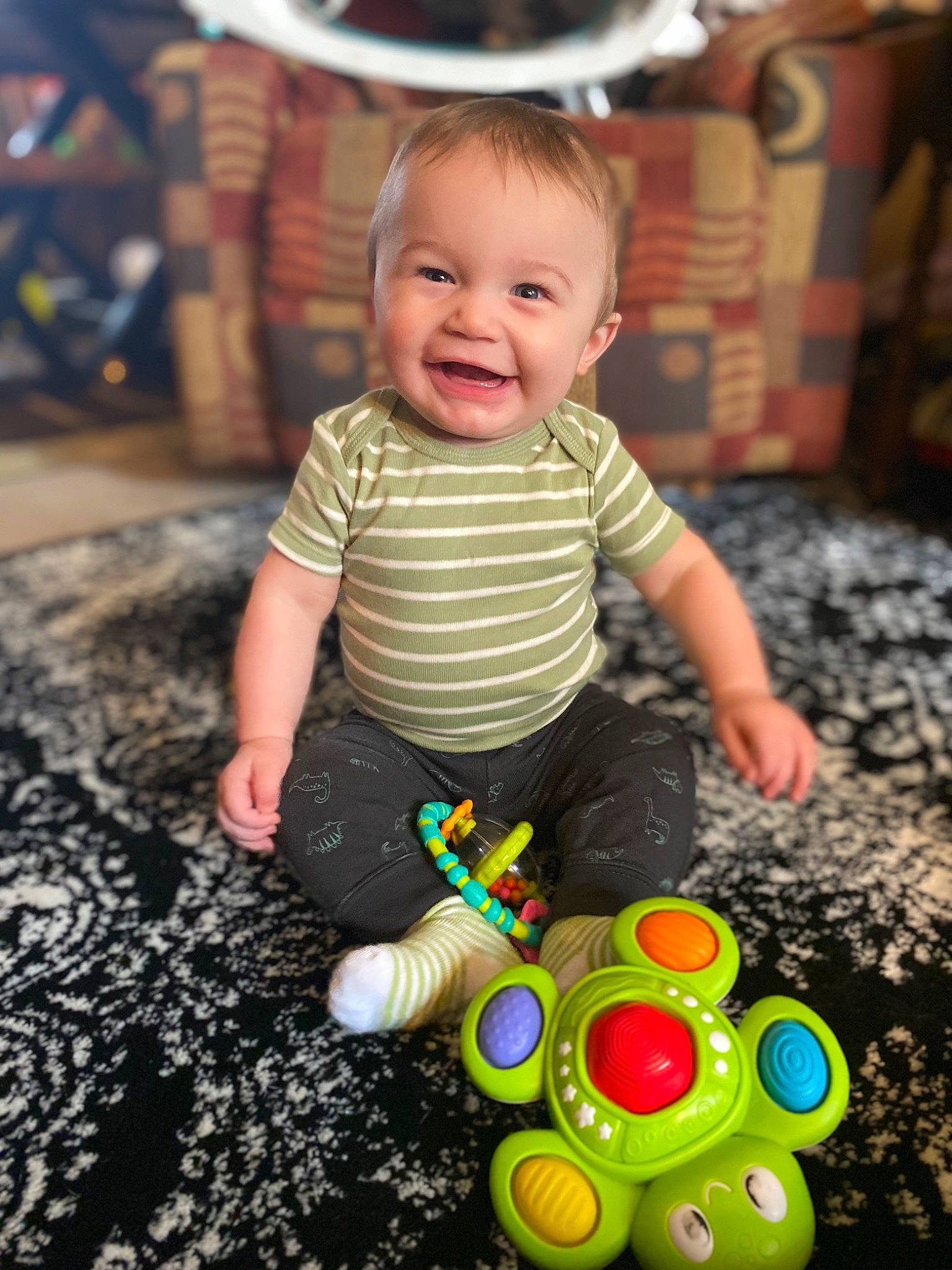 Lincoln joined the competition — help win amazing prizes! baby, baby_playing_with_toys, baby_toddler_clothing, baby_toys, ball, ball_pit, child, facial_expression, fun, happy, joy, leisure, person, photograph, sitting, smile, snapshot, standing, t_shirt, toddler
