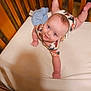 Liam joined the competition — help win amazing prizes! baby, baby_clothes, blanket, blue_eyes, child, crib, cute, floor, furniture, home, indoor, infant, onesie, person, sleeping_area, smiling, soft_lighting, tummy_time, wooden_bars, young_child