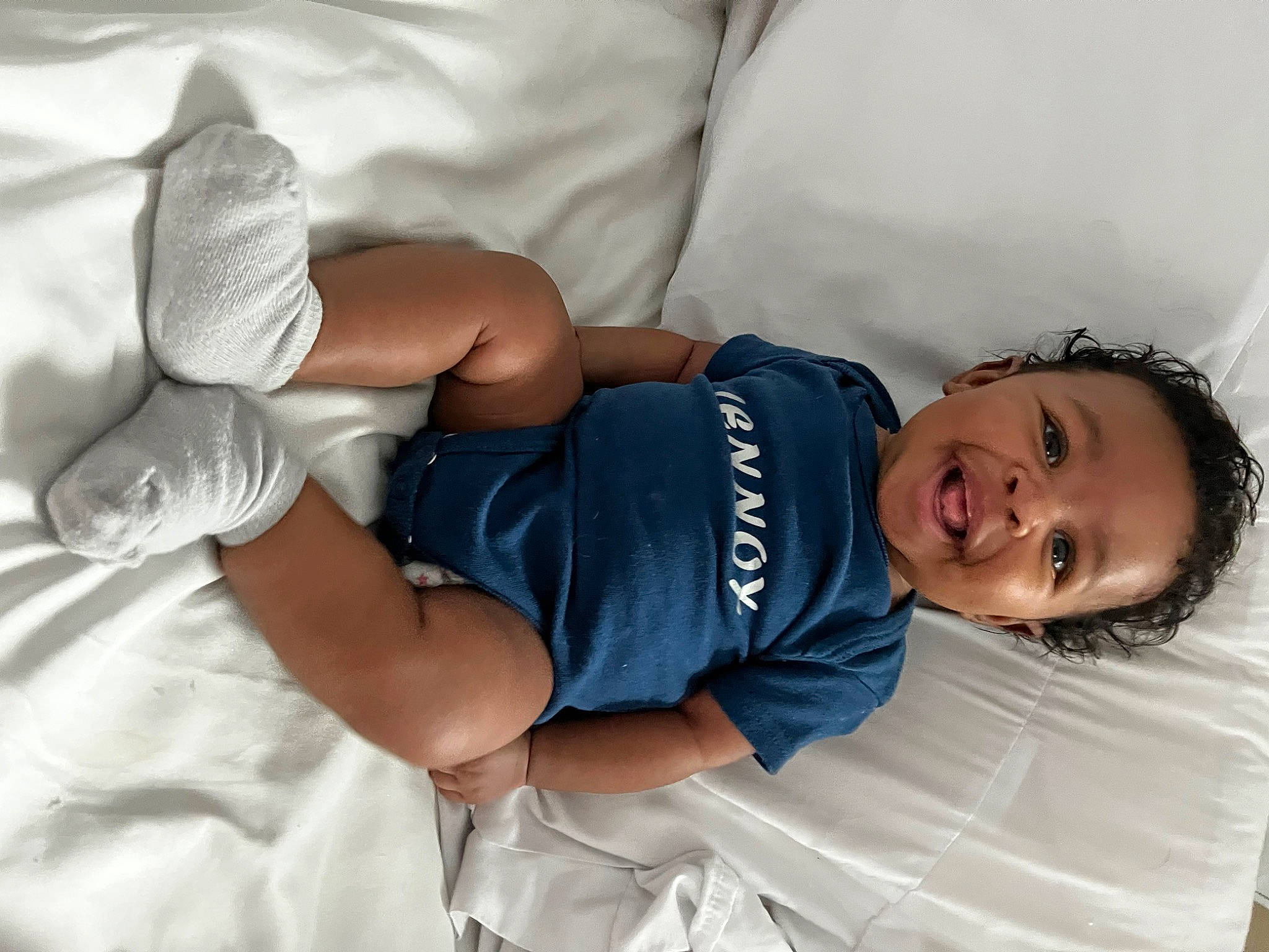 Lennox is registered to the contest to win money with this photo: abdomen, arm, baby, baby_sleeping, baby_toddler_clothing, child, cloud, comfort, elbow, gesture, hand, happy, human_leg, joint, knee, person, skin, smile, textile, thigh
