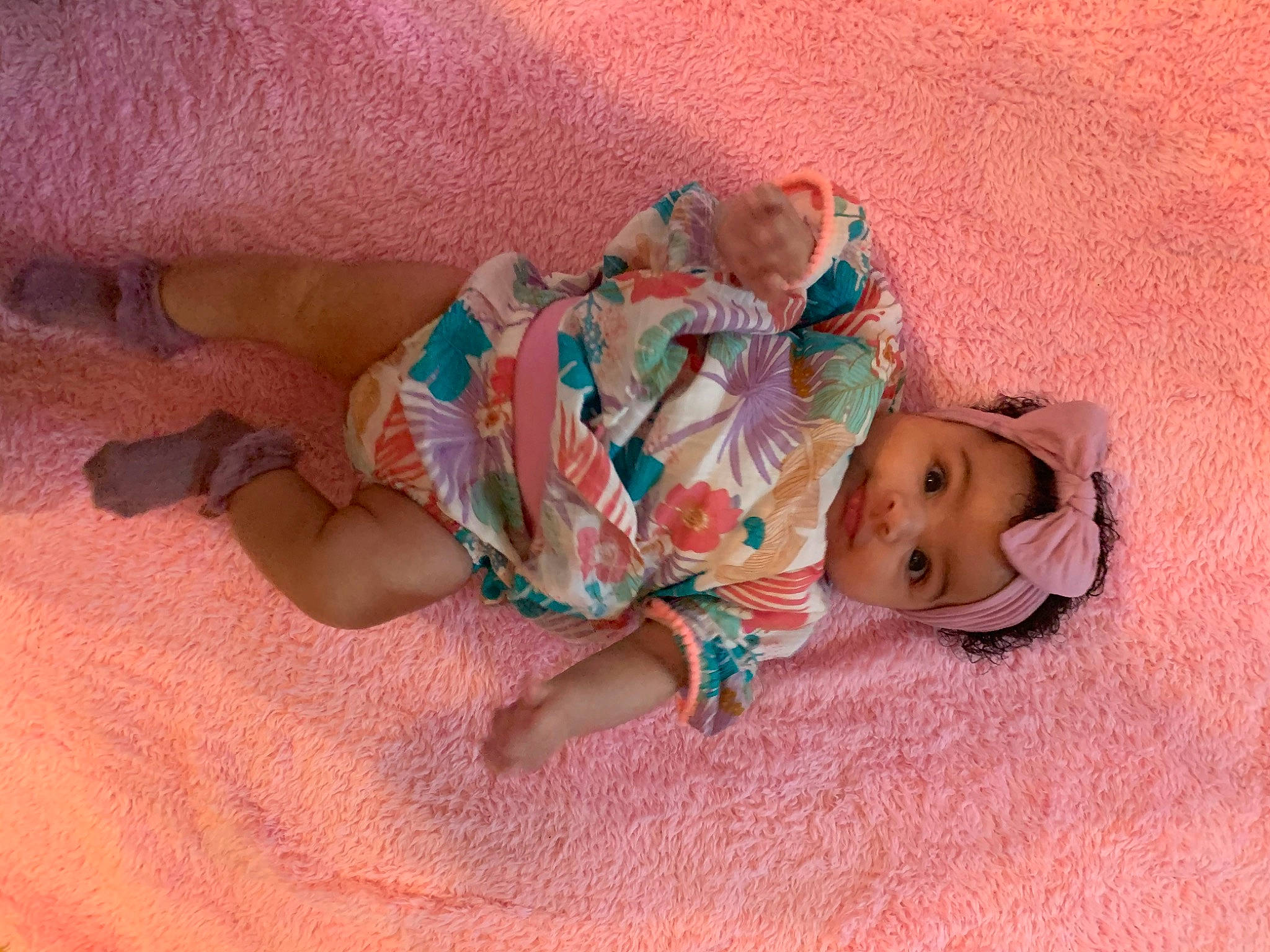 Zara joined the competition — help win amazing prizes! baby, baby_toddler_clothing, cheek, child, comfort, doll, eye, face, finger, flooring, head, headwear, human_body, human_leg, linens, person, pink, sitting, skin, sleeve