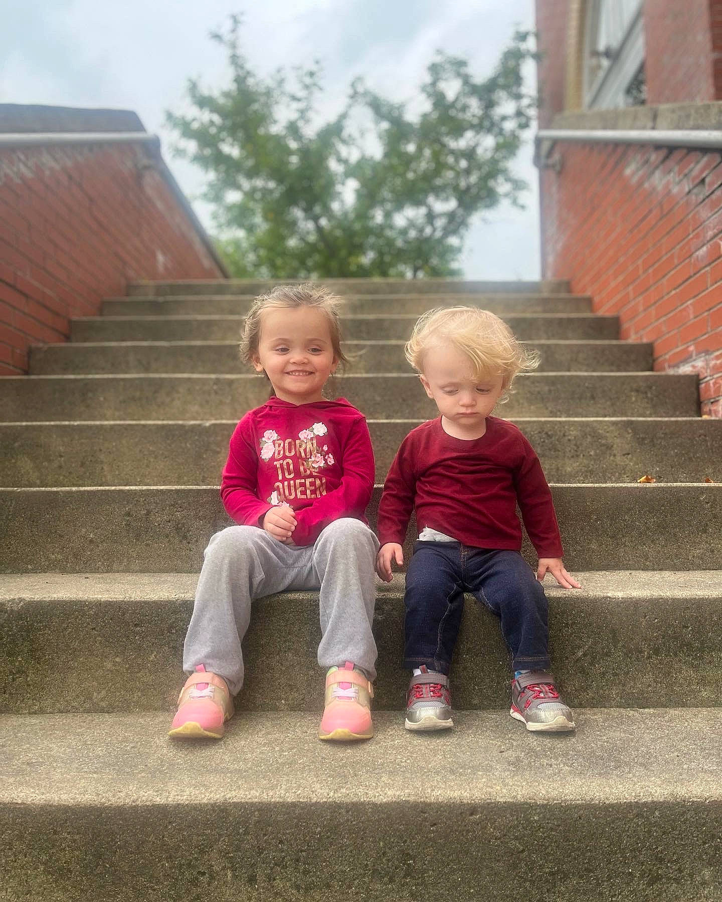 Jolynn joined the competition — help win amazing prizes! baby_toddler_clothing, brick, brickwork, child, fun, garden, grass, happy, house, joy, leg, leisure, people_in_nature, person, plant, sitting, sky, smile, sorrow, stairs