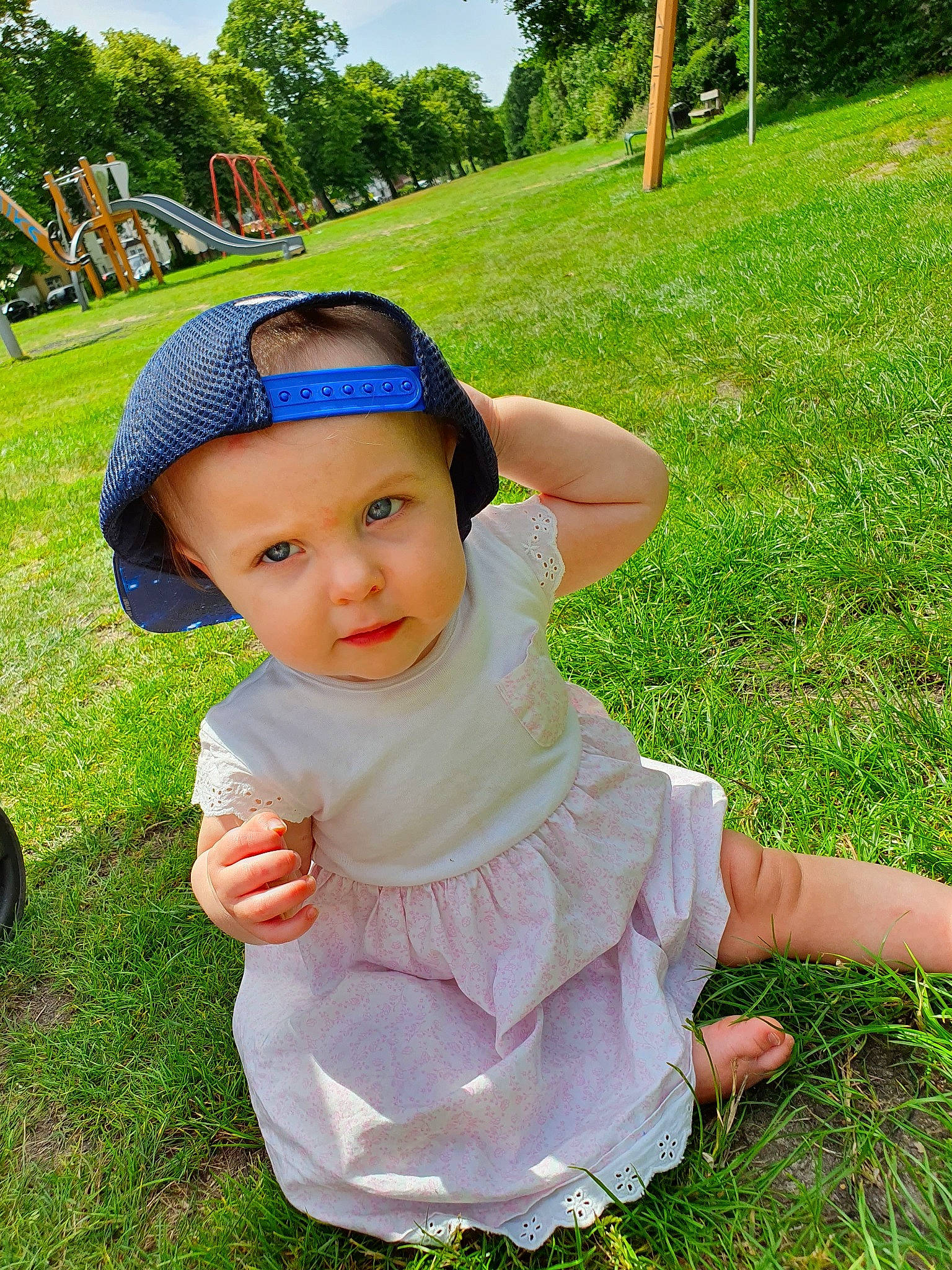 Lola joined the competition — help win amazing prizes! baby, child, dress, finger, grass, grass_family, green, hand, head, headgear, lawn, meadow, person, plant, play, product, skin, smile, summer, toddler