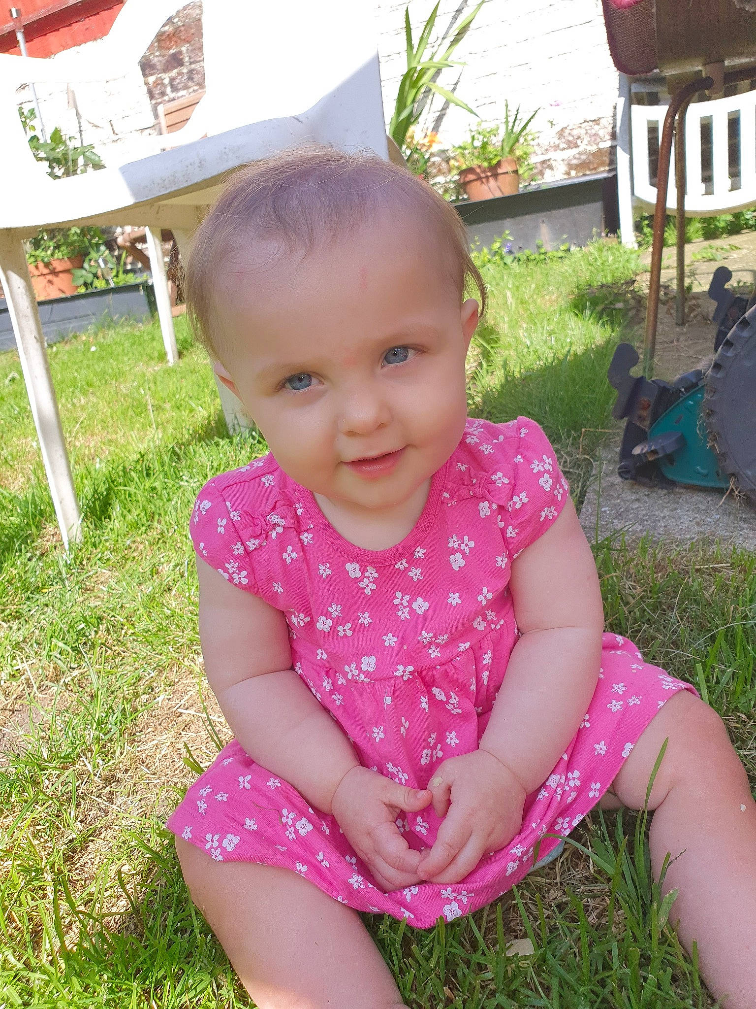 Lola joined the competition — help win amazing prizes! baby, baby_toddler_clothing, child, face, facial_expression, fun, grass, grass_family, happy, head, leaf, person, pink, plant, play, sitting, skin, smile, summer, toddler