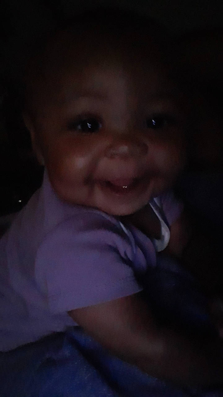 Dae'Lana Paige is registered to the contest to win money with this photo: baby, cheek, chest, comfort, darkness, ear, flash_photography, fun, gesture, hair, happy, human_body, iris, lip, nose, person, sitting, sleeve, smile, t_shirt