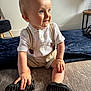 toddler, child, smiling, indoor, carpet, blue_eyes, shorts, shirt, suspenders, shoes, happy, sitting, bracelet, light, person, cute, baby, young_child, home, portrait
