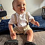 Reuben joined the competition — help win amazing prizes! baby, child, smile, suspenders, shorts, carpet, blanket, indoor, person, footwear, black_shoes, happy, cute, blue_eyes, light, home, sitting, portrait, infant, clothing