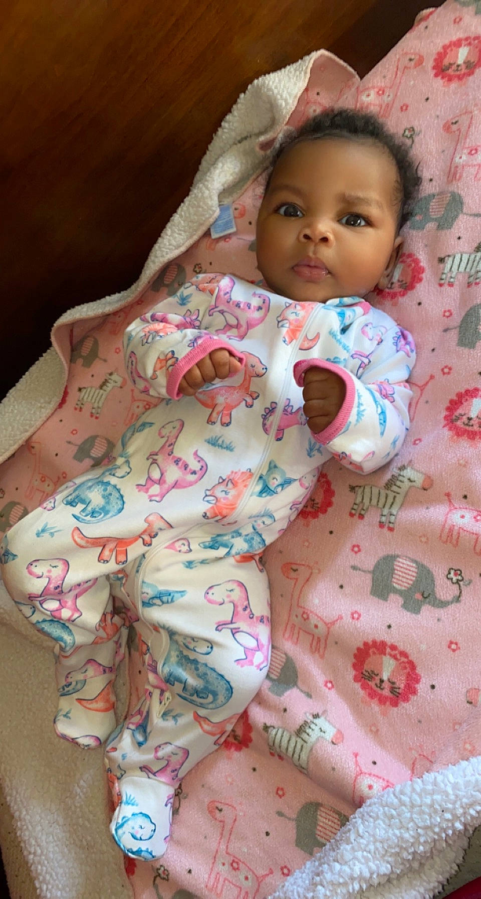Imani is registered to the contest to win money with this photo: baby, baby_products, baby_toddler_clothing, cheek, child, chin, comfort, dress, eye, face, head, iris, linens, lip, nose, pattern, person, pink, skin, sleeve