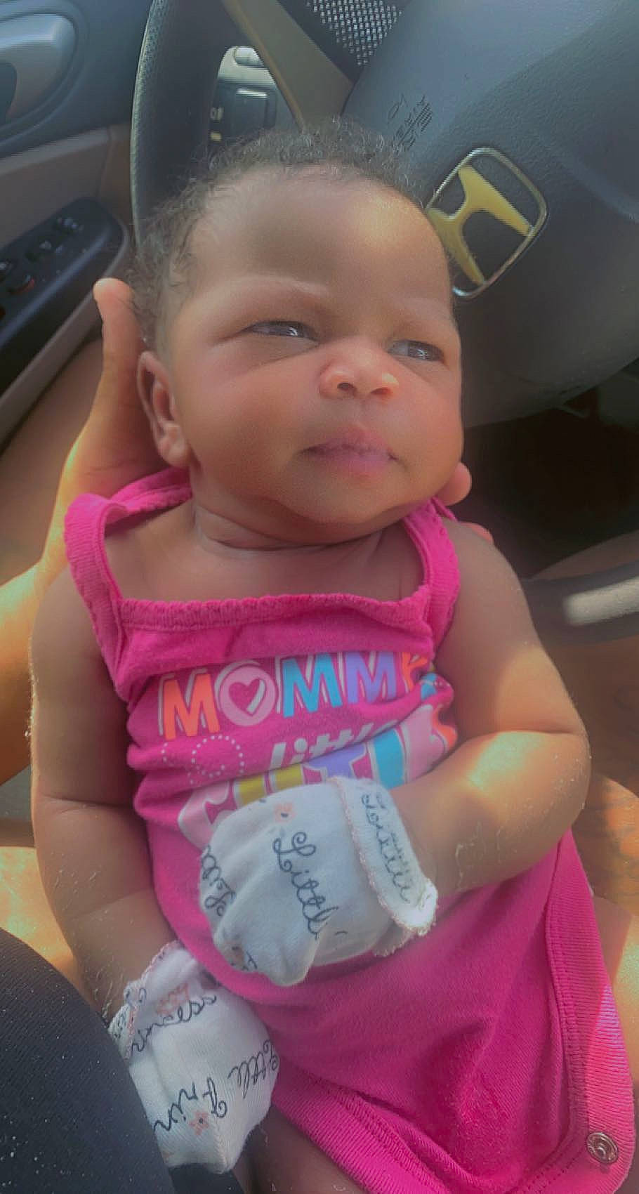 Imani is registered to the contest to win money with this photo: baby, baby_products, baby_toddler_clothing, beauty, cheek, child, eyelash, finger, fun, happy, iris, lip, magenta, mouth, nose, person, pink, skin, sleeve, smile