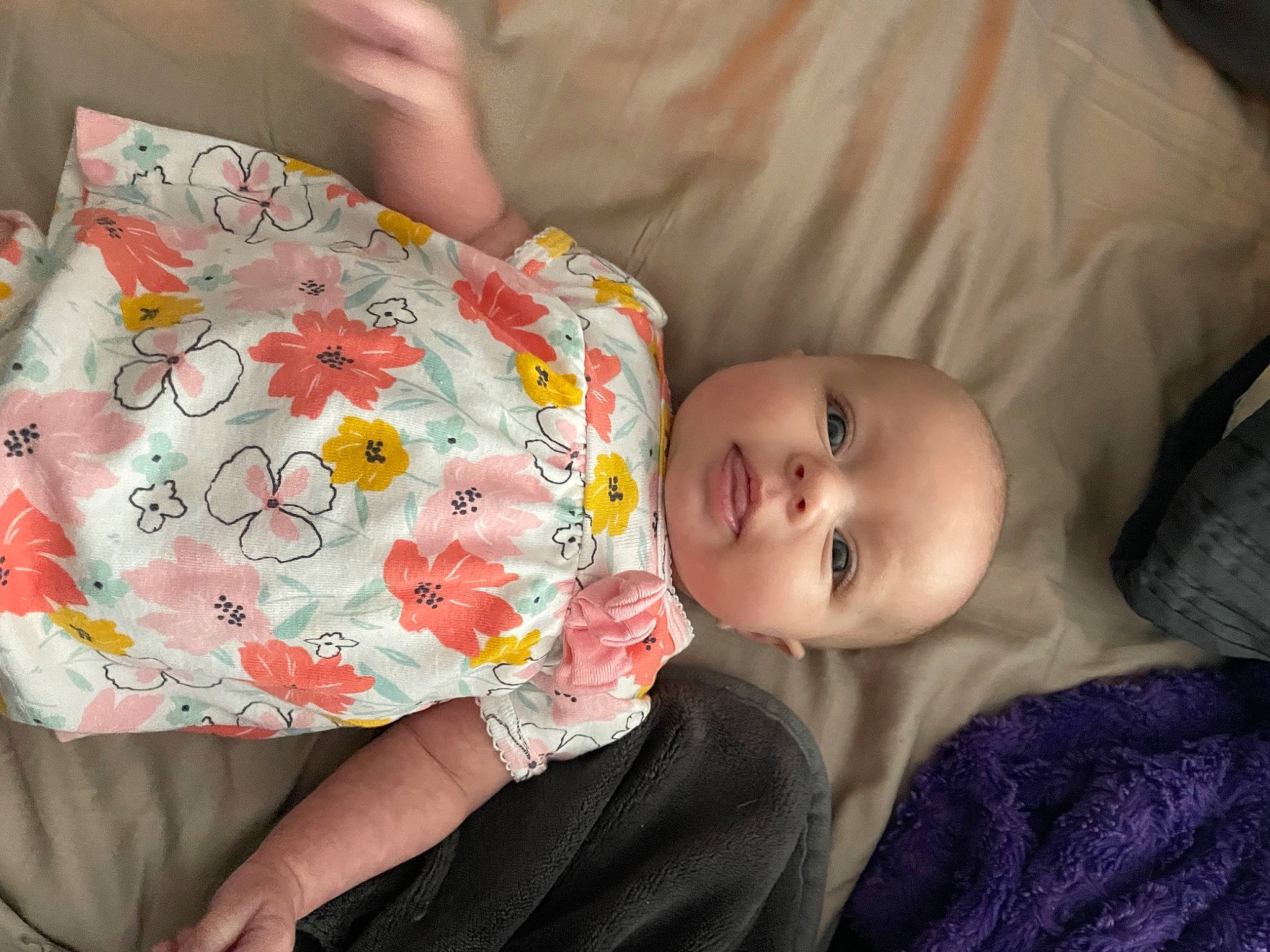 Harli joined the competition — help win amazing prizes! baby, baby_toddler_clothing, cheek, child, comfort, couch, dress, eye, facial_expression, finger, happy, head, human_body, linens, lip, mammal, mouth, person, product, skin