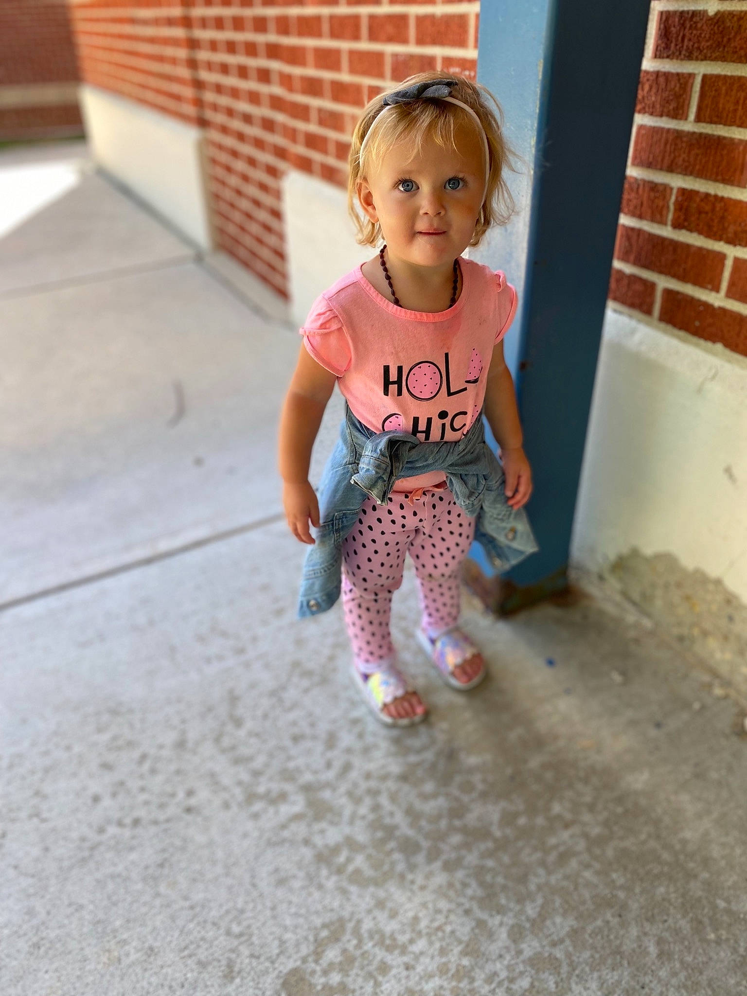 Laikyn is registered to the contest to win money with this photo: baby_toddler_clothing, eye, face, fawn, floor, flooring, hair, happy, head, human_body, knee, leg, person, road_surface, sleeve, street_fashion, t_shirt, thigh, toddler, waist