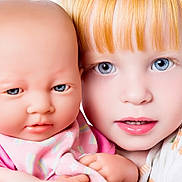 Willow is registered to the contest to win money with this photo: child, doll, baby_doll, red_hair, blue_eyes, face, portrait, close_up, toy, playtime, pink_clothing, human, realistic_doll, innocence, curiosity, childhood, cute, expression, holding, young