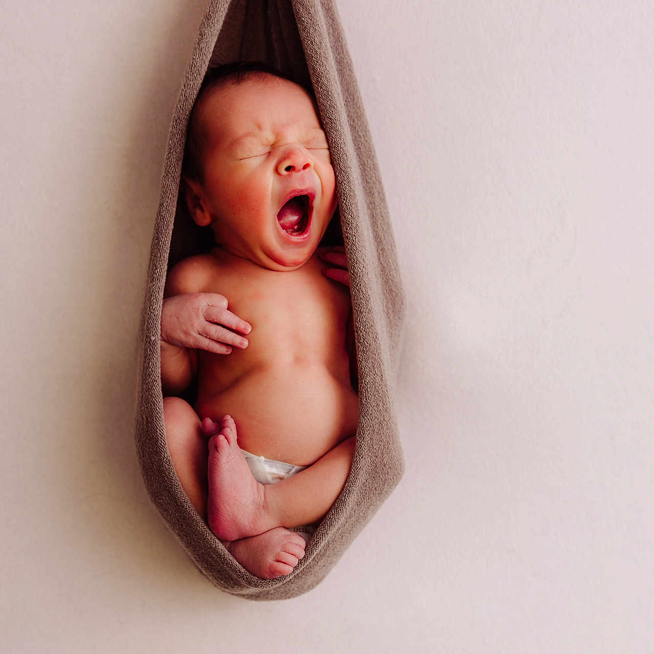 Adonis is registered to the contest to win money with this photo: baby, blanket, bodypart, face, finger, hand, head, newborn, person, photography, portrait, towel, yawning