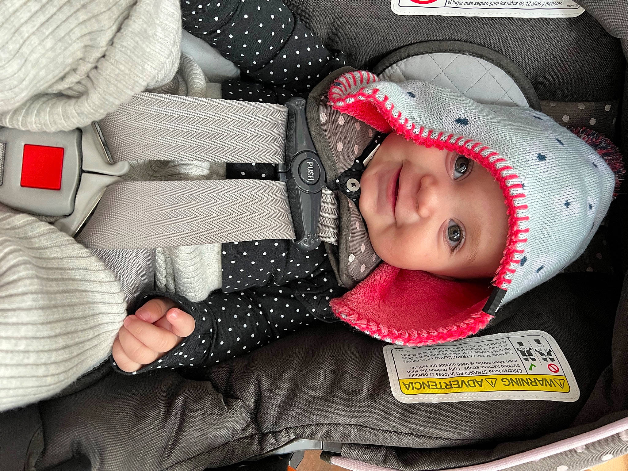 Kennedy is registered to the contest to win money with this photo: auto_part, baby, baby_carriage, baby_products, baby_toddler_clothing, baseball_cap, cap, child, comfort, cool, happy, headgear, headwear, helmet, mouth, pattern, person, personal_protective_equipment, product, sleeve