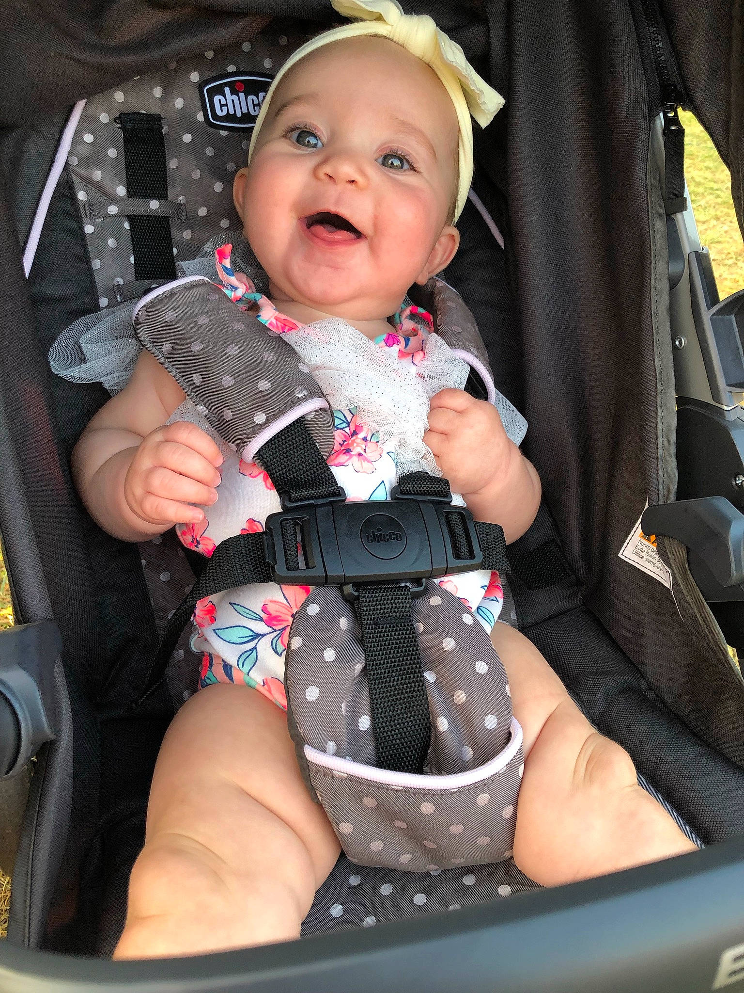 Kennedy is registered to the contest to win money with this photo: auto_part, baby, baby_carriage, baby_toddler_clothing, bag, car_seat, child, comfort, finger, knee, pattern, people, person, pink, product, sitting, skin, sleeve, smile, thigh