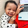 Aireon joined the competition — help win amazing prizes! baby, child, smiling, curly_hair, pajamas, pacifier, arm, hand, laptop, red_blanket, indoor, couch, close_up, happy, human, infant, technology, comfort, resting, cute