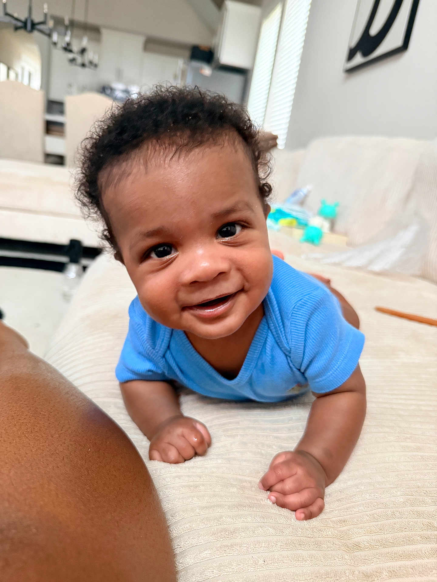 Aireon joined the competition — help win amazing prizes! baby, infant, smiling, blue_shirt, couch, living_room, curtains, window, furniture, person, skin, hand, face, eyes, hair, happy, indoors, child, toddler, home