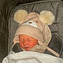 baby, sleeping, hat, knit_hat, pom_poms, bear_ears, blanket, striped_blanket, stroller, cushion, face, closed_eyes, infant, warm, cozy, soft_texture, child, cute, winter_clothing, newborn