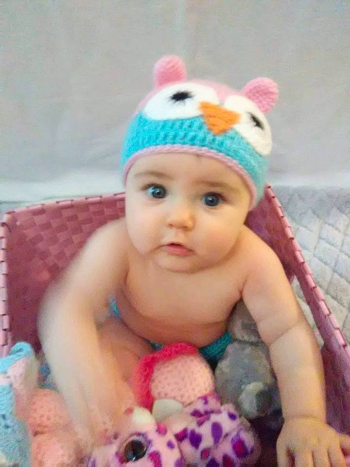 Makynna is registered to the contest to win money with this photo: beanie, bonnet, cap, cheek, child, crochet, ear, hair_accessory, hat, headband, headgear, infant, knit_cap, knitting, person, pink, product, smile, toddler