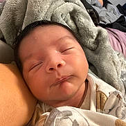 Benito joined the competition — help win amazing prizes! baby, sleeping, blanket, cozy, infant, face, closeup, soft, wrapped, peaceful, child, newborn, portrait, indoors, cute, resting, person, fabric, comfort, nap