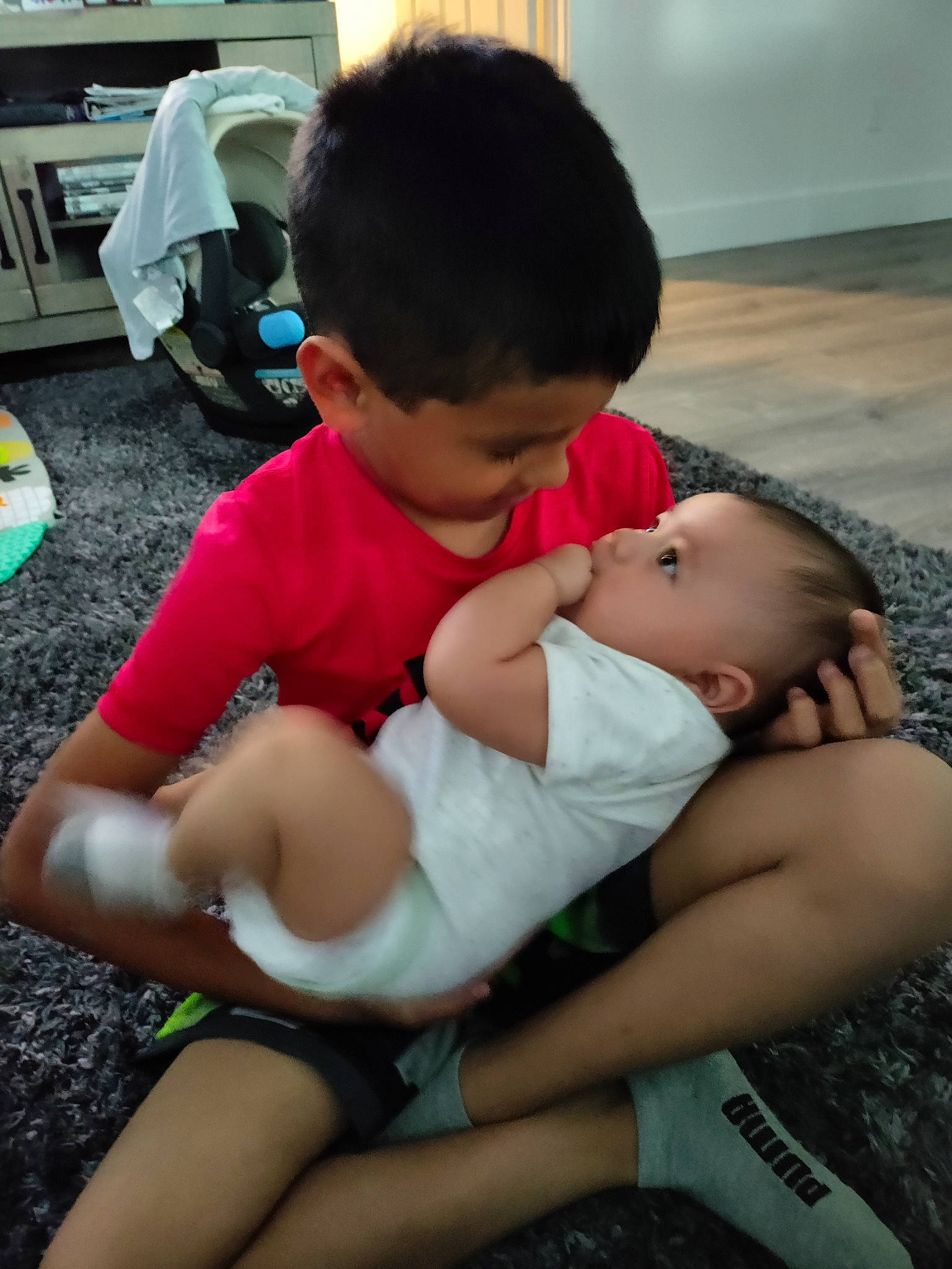 Malaki joined the competition — help win amazing prizes! arm, baby, comfort, facial_expression, finger, hairstyle, hand, happy, human, human_body, interaction, joint, leg, mammal, person, shorts, shoulder, skin, thigh, toddler