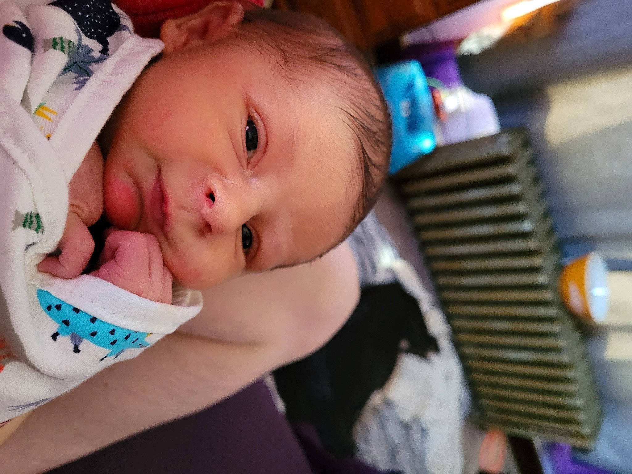 Connor is registered to the contest to win money with this photo: baby, baby_products, baby_toddler_clothing, cheek, child, comfort, eye, eyebrow, eyelash, happy, iris, lip, mouth, nose, person, portrait_photography, sitting, skin, smile, toddler