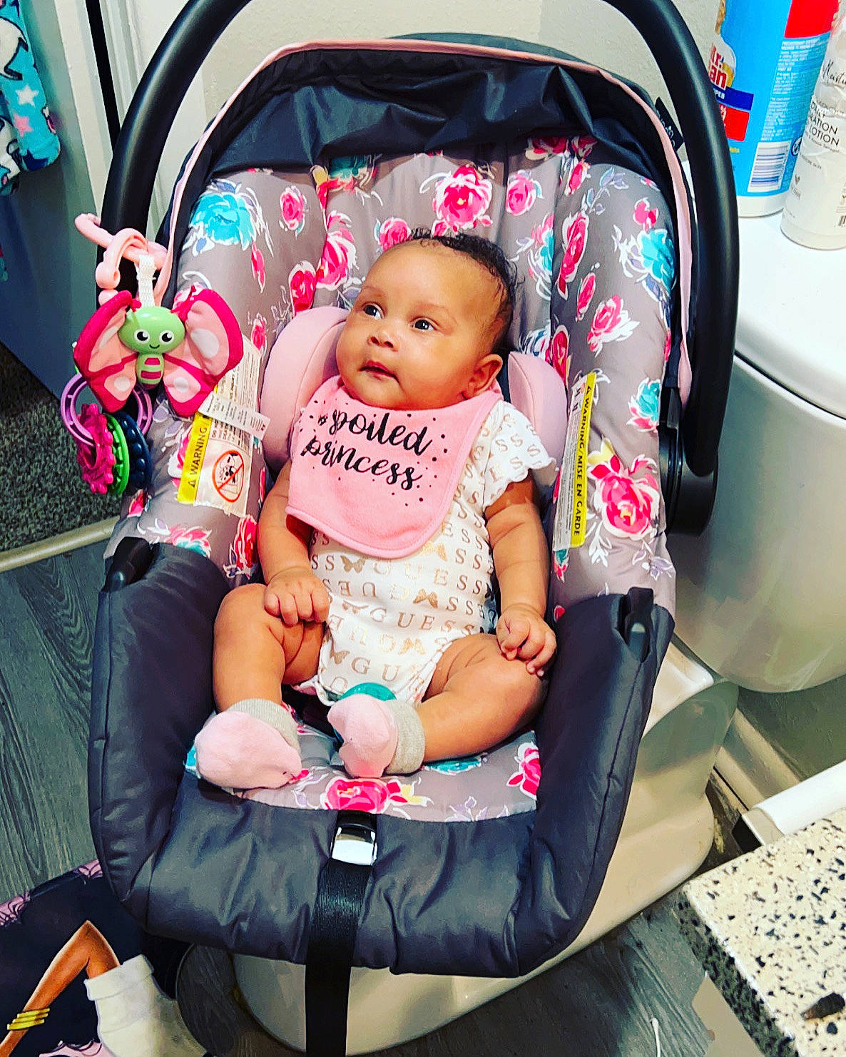 Ariana is registered to the contest to win money with this photo: auto_part, automotive_design, baby, baby_carriage, baby_products, baby_toddler_clothing, car_seat, child, comfort, event, fun, happy, lap, luxury_vehicle, motor_vehicle, person, pink, sitting, toddler, travel