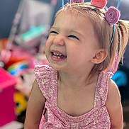 Payton joined the competition — help win amazing prizes! toddler, child, smiling, happy, pink_dress, headband, indoor, portrait, cute, playful, face, young_child, blonde_hair, expression, toy, colorful_background, cheerful, person, closeup, baby