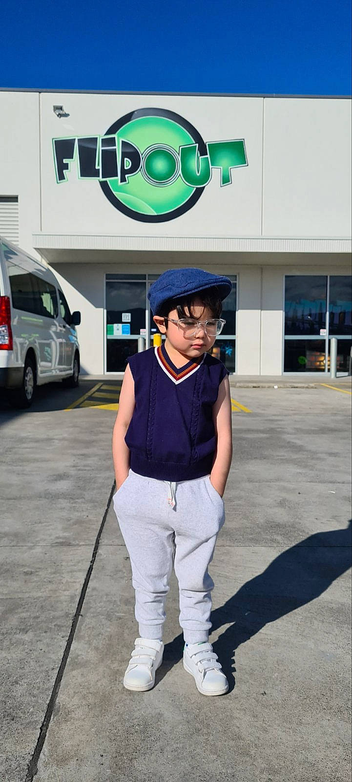 Cayden is registered to the contest to win money with this photo: asphalt, automotive_exterior, automotive_lighting, cap, compact_van, costume, electric_blue, eyewear, fashion_accessory, headwear, jewellery, parking, person, personal_protective_equipment, road, street, tire, uniform, van, vehicle_door