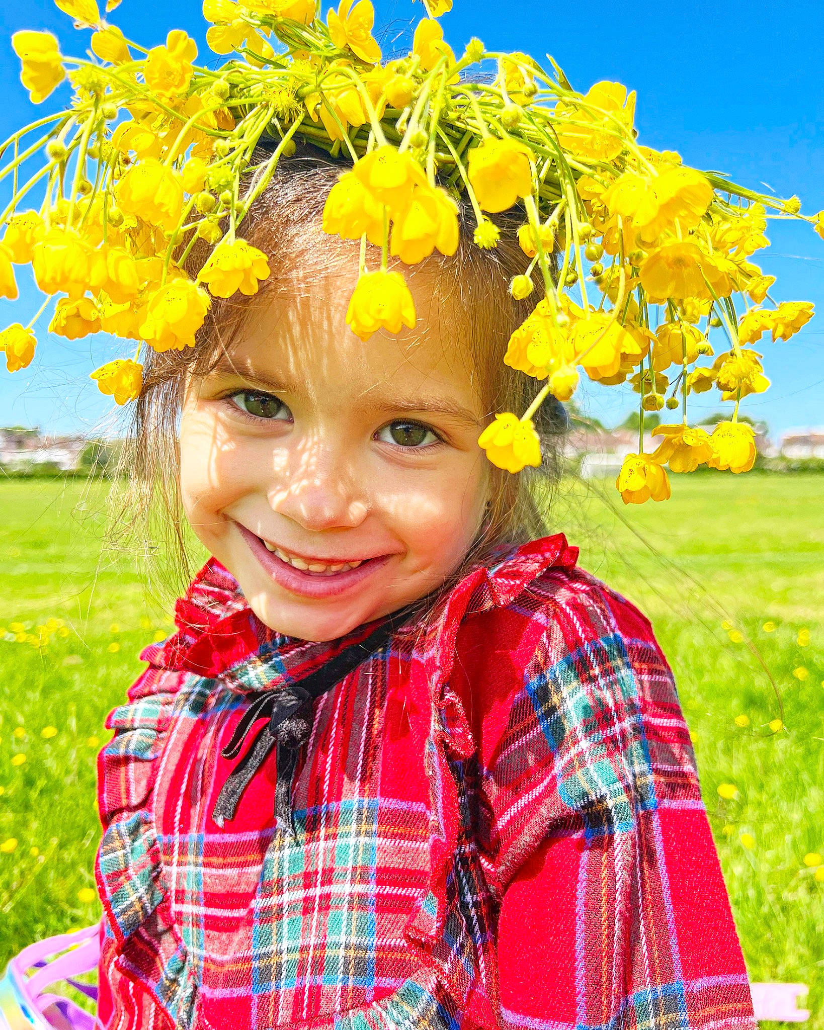Daria is registered to the contest to win money with this photo: event, flower, fun, grass, green, happy, headpiece, headwear, joy, leaf, lei, nature, pattern, people_in_nature, person, plaid, plant, sky, smile, summer